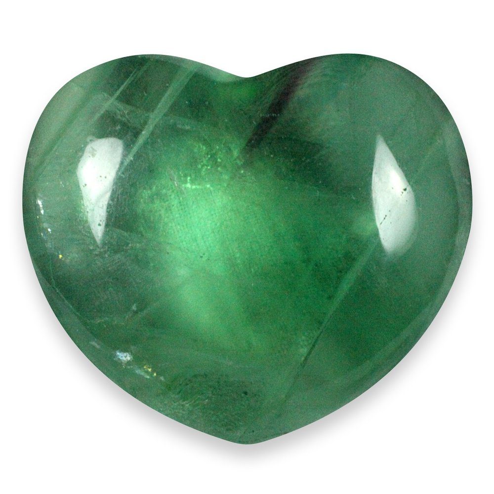 A heart-shaped green fluorite crystal symbolising heart chakra healing, emotional balance, and gentle energetic harmony.