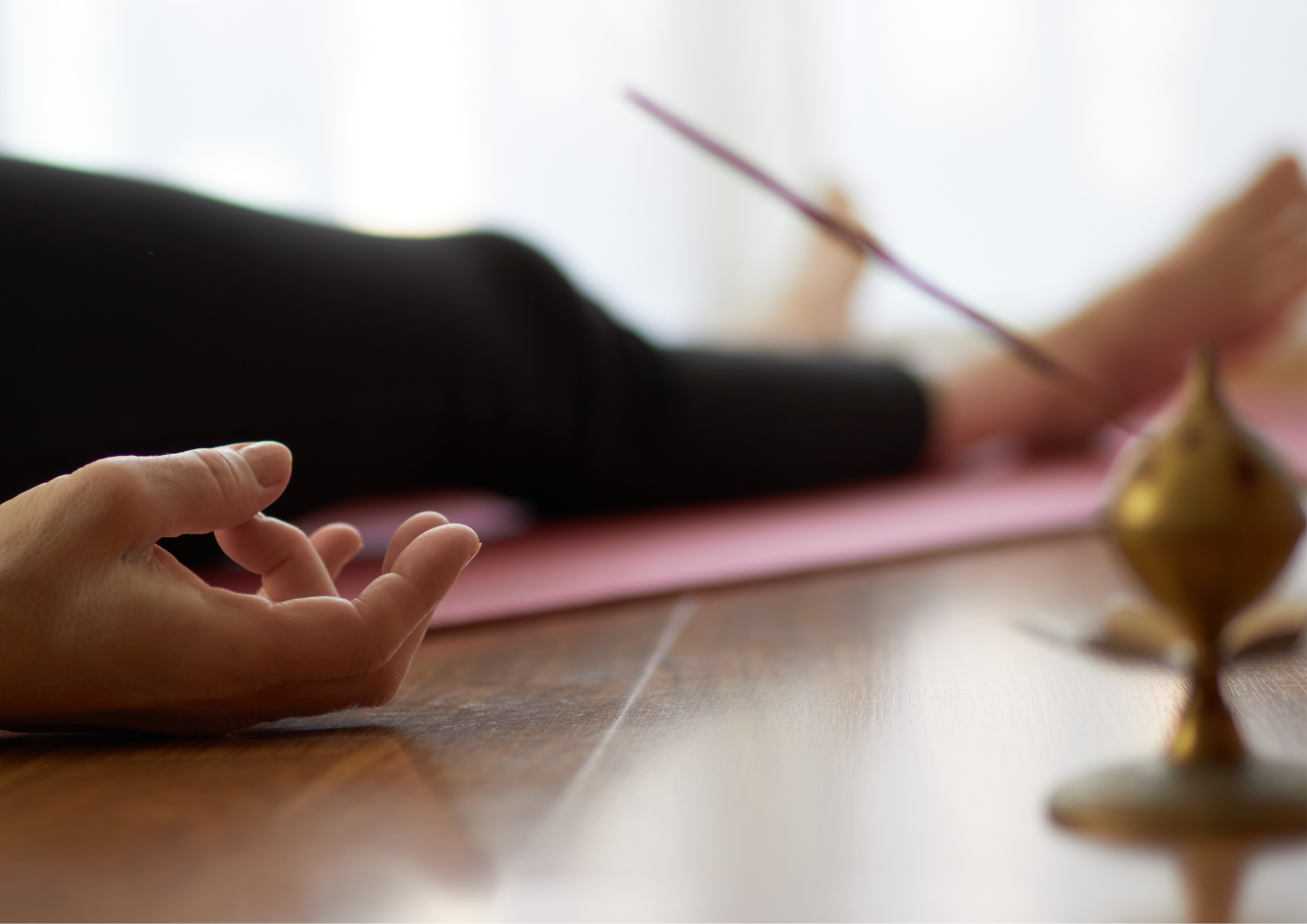 A person resting peacefully after a holistic session, integrating movement, touch, and energy work.