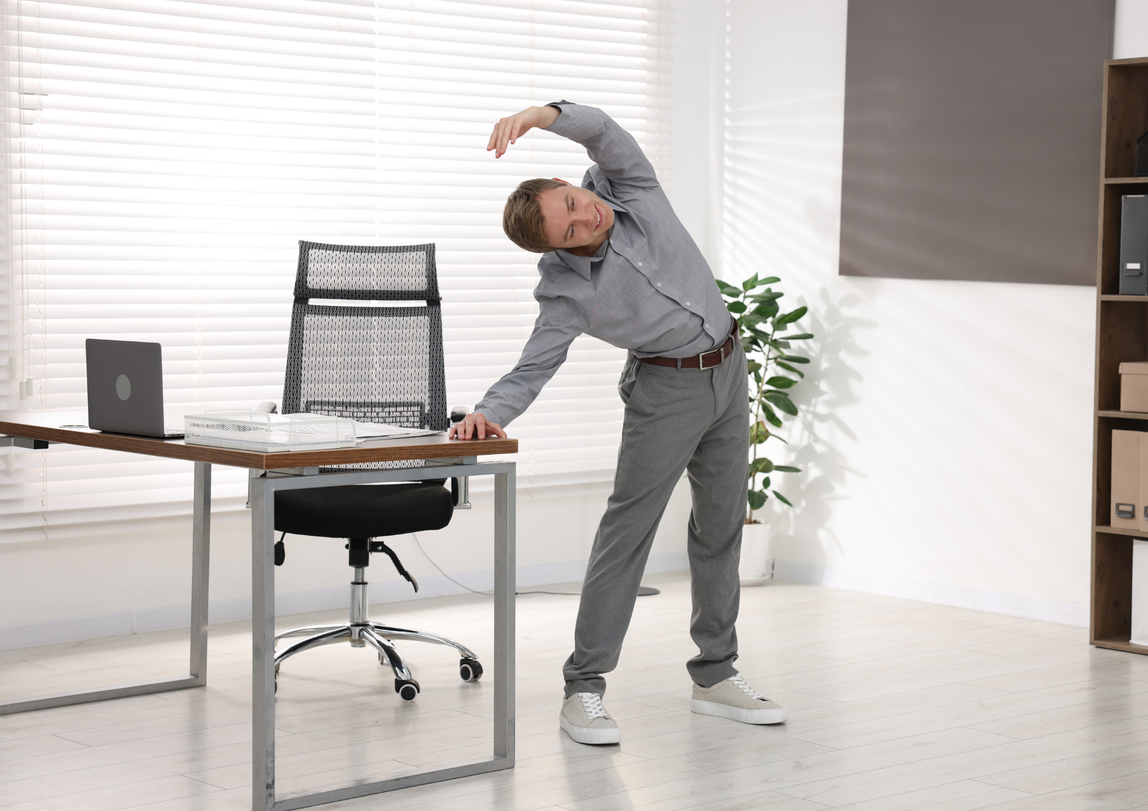 A person taking a short movement break after prolonged sitting