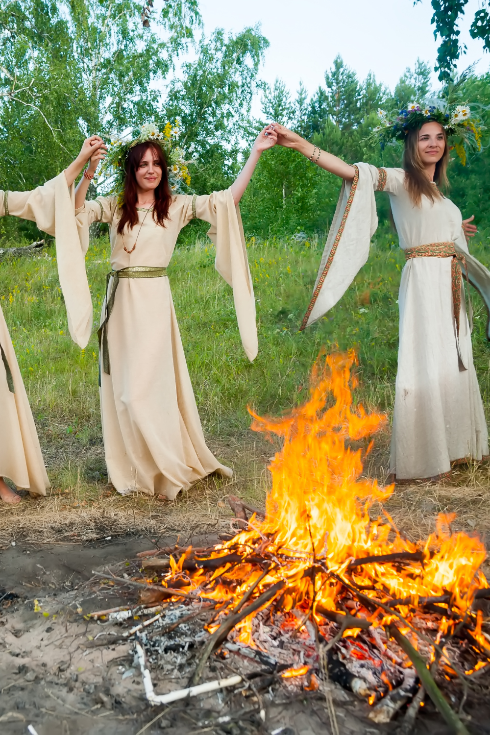 Summer Solstice summer ritual - women dancing around fire 